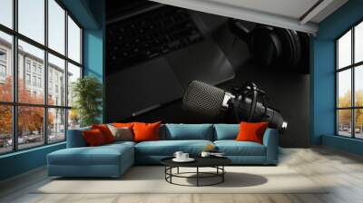 Close-up. Studio headphones on laptop, studio microphone. Radio, vocal studio, recording studio, sound work, podcast, journalism, new modern technologies. Banner, invitation. Wall mural