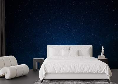 Dark blue night sky and small twinkling stars. Abstraction. Minimalism. There is no one in the photo. Astrology, Galaxy, Space. Background. Wallpaper. Texture. Wall mural