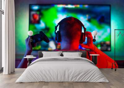 gaming game play tv fun gamer gamepad guy controller video console playing player holding hobby playful enjoyment view concept - stock image Wall mural