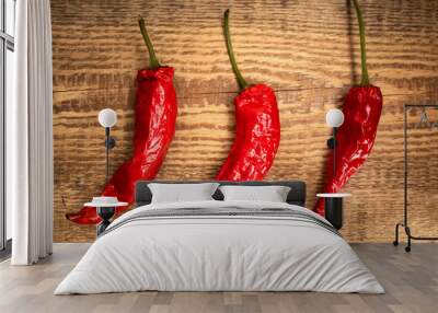 Red peppers on the old wooden background. Dried chilly peppers is a food of Asian. Spicy food concept. Wall mural