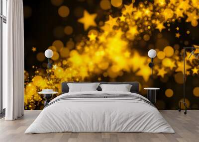 Golden Christmas and New Year glittering stars swirl on black bokeh background, backdrop with sparkling golden stars, holiday garland, magic glowing dust, lights. Gold Abstract Glitter Blinking spar Wall mural