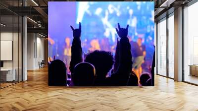 Fans cheering musicians on stage at live rock music concert Wall mural