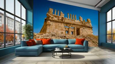 It's Ruins of the Qasr al Abd, a large ruin in Iraq Al Amir, Jordan. Wall mural