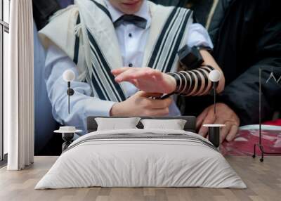 young jew boy praying tfilin near western wall in talit after his barmitzvah Wall mural