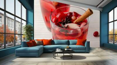 Orange and cranberry punch with orange slices and spices. Wall mural