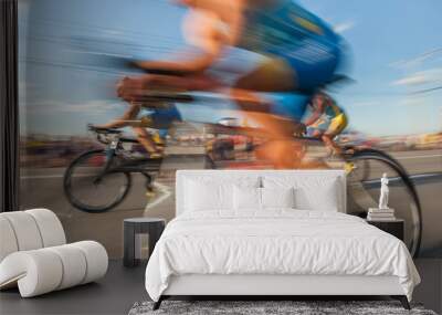 Fast moving bicycles in blur. Wall mural