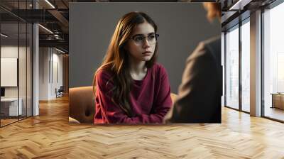 Sad teenage girl at therapy meeting with psychologist isolated with white highlights, png Wall mural