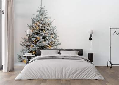 Snow-covered Christmas tree with warm lights, minimalistic style Wall mural