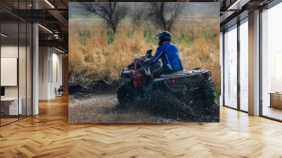 Active ATV and UTV riding in the mud and water at sunny day Wall mural