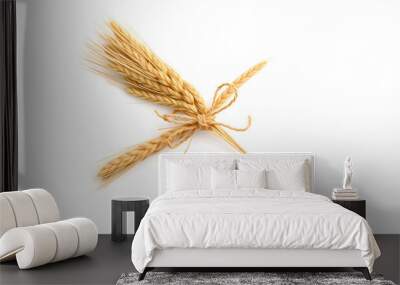 Wheat bundle decorative sheath tied with raffia bow on white background. Agricultural organic harvest summer autumn grain produce isolated with white highlights, png Wall mural