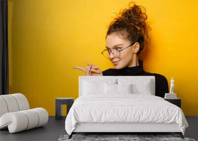 Pretty teenage girl with happy face on yellow background Wall mural