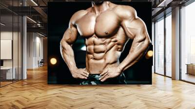 Bodybuilder strong man pumping up abs muscles Wall mural