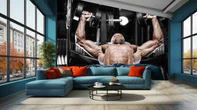 Brutal strong bodybuilder athletic men pumping up muscles with dumbbells. Wall mural