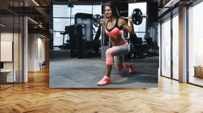 strong sexy athletic young girl working out in gym Wall mural