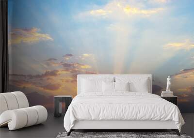 Sunrise with clouds illuminated by the rays of the sun. Wall mural