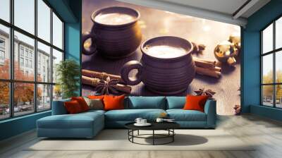 Two brown clay cups of black coffee,  Christmas decoration, spices on  the wooden table. Selective focus. Toned image Wall mural