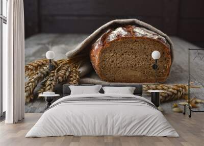 Fresh rye flour bread with wheats Wall mural