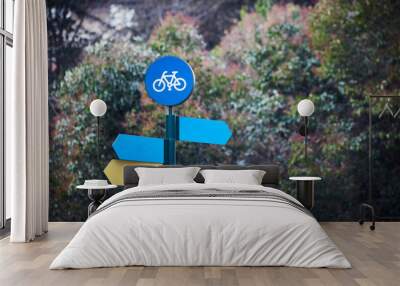 Bicycle lane road traffic sign with direction plate signs template and nature look background on the behind Wall mural