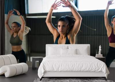 Beautiful caucasian woman in activewear exercising Wall mural