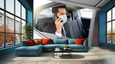 Businessman With Face Mask In Taxi During Coronavirus Crisis Wall mural