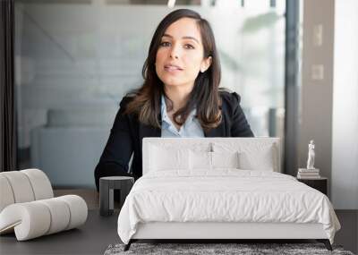 Businesswoman talking over video call Wall mural