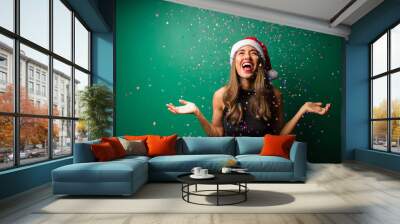 Cheerful woman celebrating Christmas Wall mural