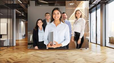 Confident hispanic business woman in office Wall mural