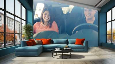 Couple traveling by car Wall mural