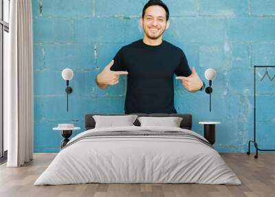 Excited man wearing a black casual t-shirt Wall mural