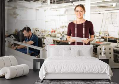 Female supervisor with a tablet Wall mural