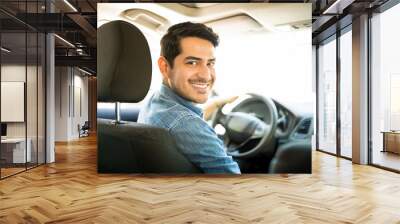 Good looking guy driving car Wall mural