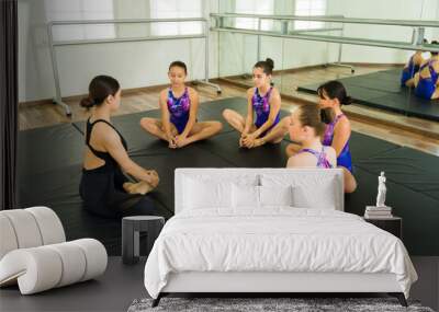 Gymnastic instructor preparing for a practice Wall mural