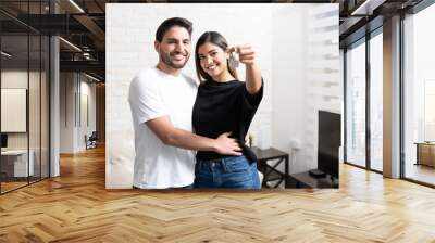 Happy Latin Couple With New House Key Wall mural