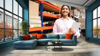 Happy Young Latin Worker With List Working At Factory Wall mural