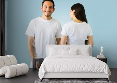 Hispanic couple made custom t-shirts Wall mural