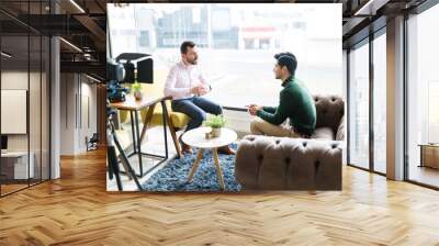 Journalist Interviewing Businessman In Workplace Wall mural