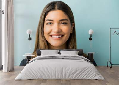 Pretty Hispanic Businesswoman Smiling In Studio Wall mural