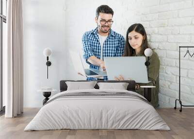 Professionals With Laptops Against Wall In Office Wall mural