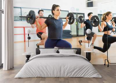 Weightlifter Lifting Barbell While Doing Lunges With Friends Wall mural