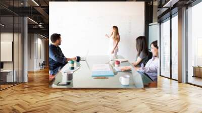 Young woman giving business presentation Wall mural