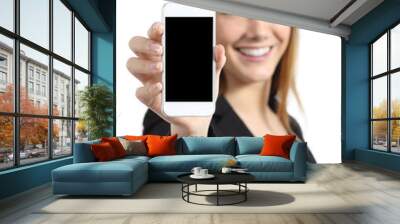 Business woman smiling showing a blank smart phone screen Wall mural