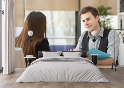 Businessman and woman having an interview at office Wall mural