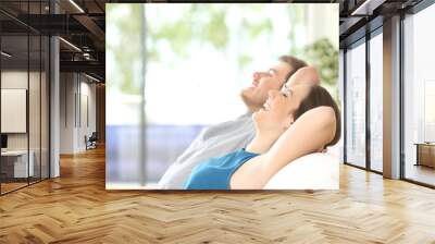 Couple breathing and resting at home Wall mural