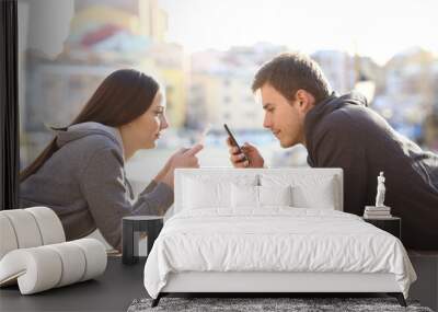 Couple of teens obsessed with smart phones Wall mural