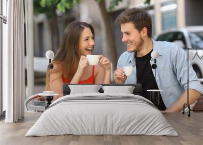 Couple or friends talking and drinking in a restaurant Wall mural