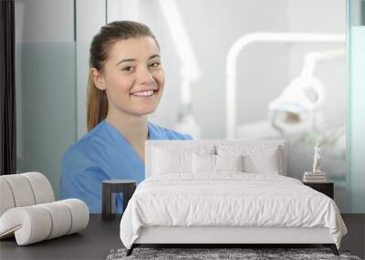 Female doctor posing in a dentist office Wall mural