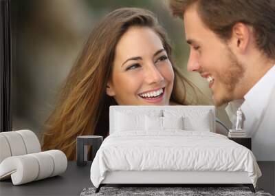 Funny couple laughing with a white perfect smile Wall mural