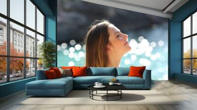 Girl breathing fresh air on a tropical beach on holidays Wall mural