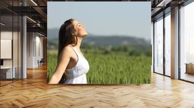 girl breathing fresh air with white dress Wall mural