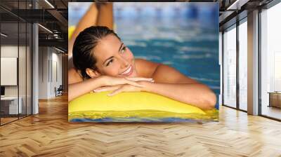 Girl enjoying summer vacations on a mattress Wall mural